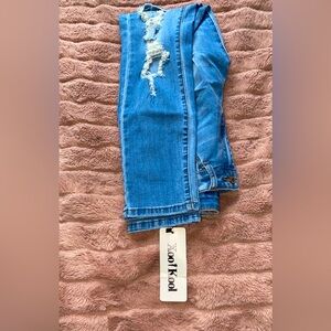 NWT high waisted distressed jeans.